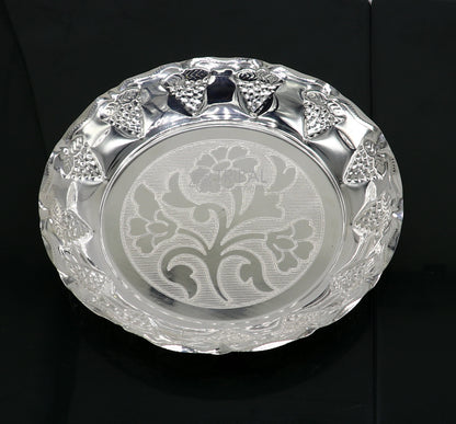 Sterling silver handcrafted puja tray with lightweight design, featuring traditional silver utensils and decorative silver thali.
