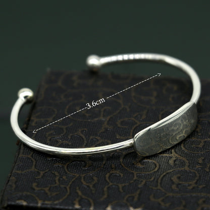 Sterling silver baby bangle bracelet with plain bright design, ideal for newborns, by Tribal Ornaments.