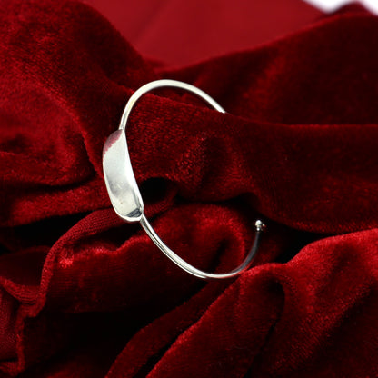 Sterling silver baby bangle bracelet with a bright, plain design, perfect for newborns, by TRIBAL ORNAMENTS.