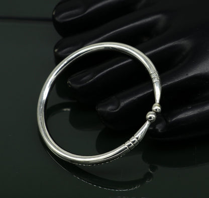 925 sterling silver baby bangle by Tribal Ornaments, bright plain design, adjustable newborn bracelet, ideal for gifting.