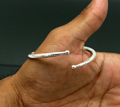 925 sterling silver baby bangle by TRIBAL ORNAMENTS featuring a plain bright design, adjustable newborn baby bracelet, ideal for gifting.