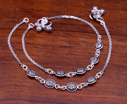 Sterling silver ankle bracelet with flower design and charm, stylish feet jewelry from TRIBAL ORNAMENTS.