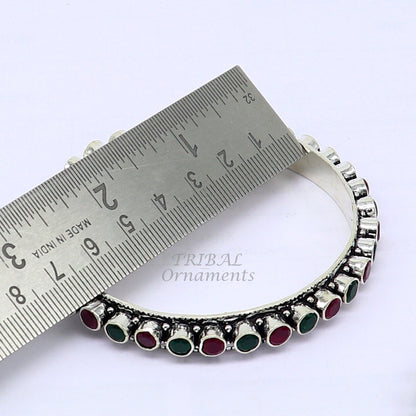 Sterling silver bangle bracelet with vibrant green and red stones, elegant jewelry piece for women and girls by TRIBAL ORNAMENTS