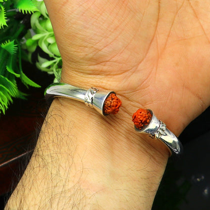 Sterling silver bangle cuff with shiny Rudraksha beads, unisex tribal jewelry, flexible design, bright and elegant for stylish wear.