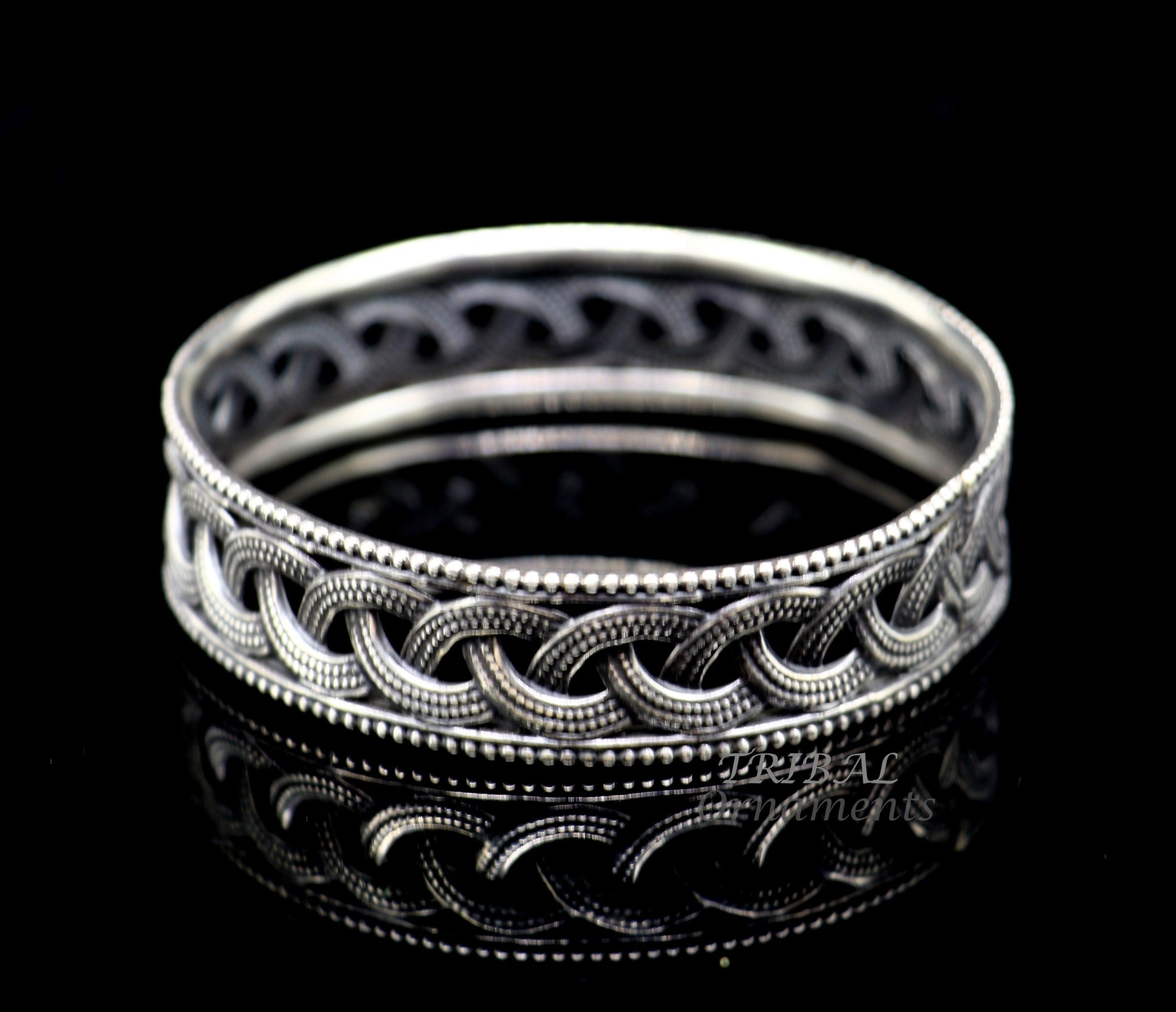 Sterling silver flower design bangle bracelet from Tribal Ornaments, elegant wedding jewelry for brides.