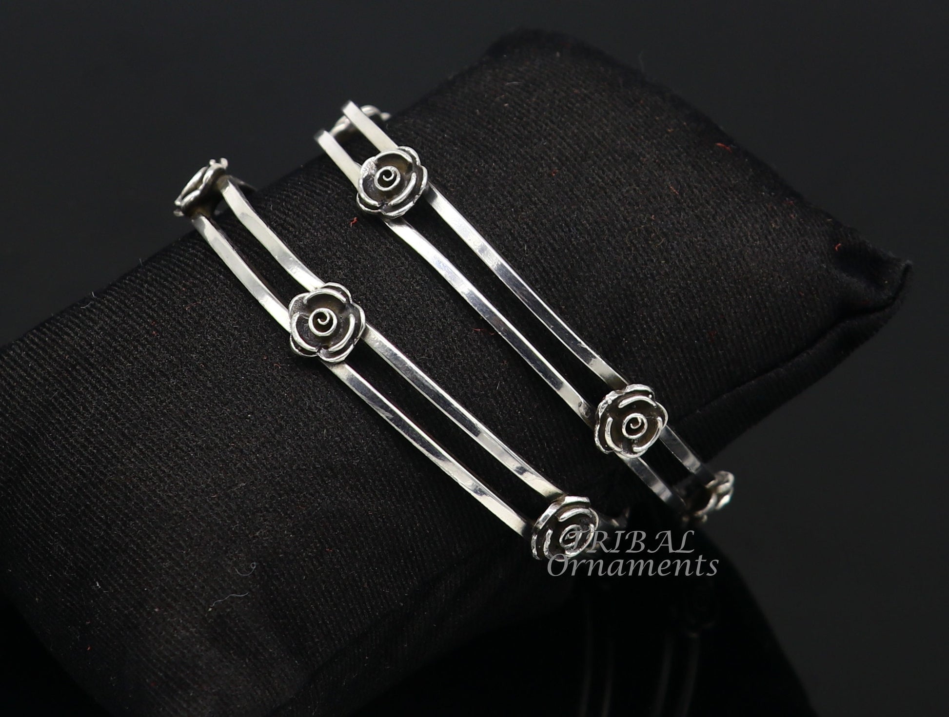 Sterling silver flower design bangle bracelet by TRIBAL ORNAMENTS, featuring intricate floral patterns for wedding jewelry.