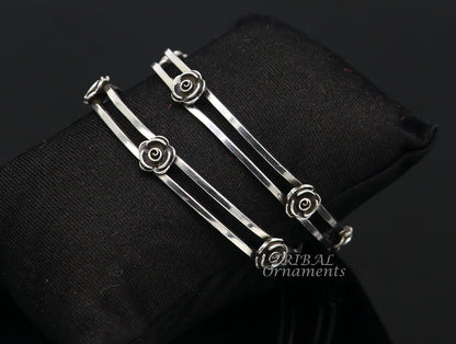 Sterling silver flower design bangle bracelet by TRIBAL ORNAMENTS, featuring intricate floral patterns for wedding jewelry.