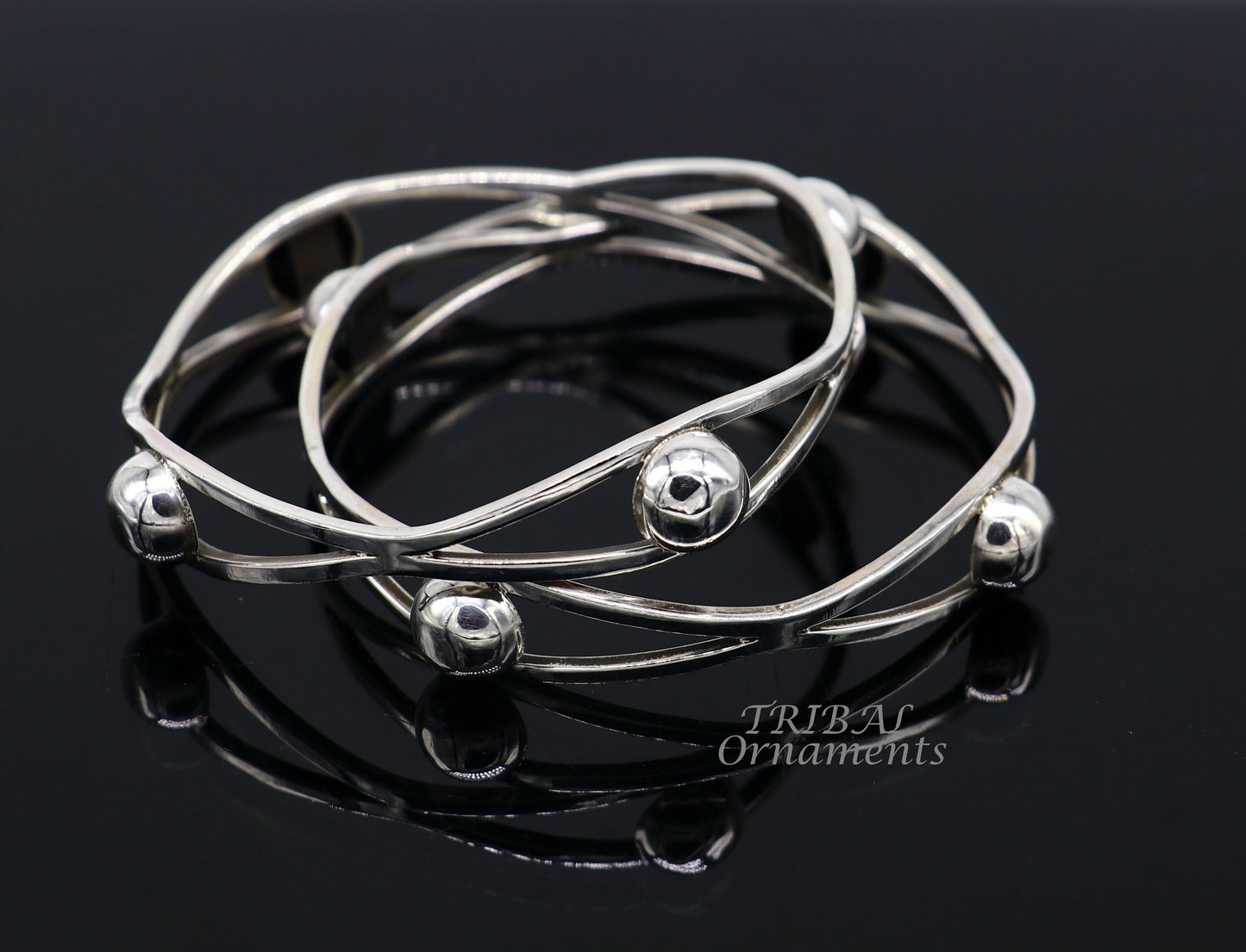 Sterling silver ball design bangle bracelet from TRIBAL ORNAMENTS, featuring floral details in a handmade wedding jewelry style.