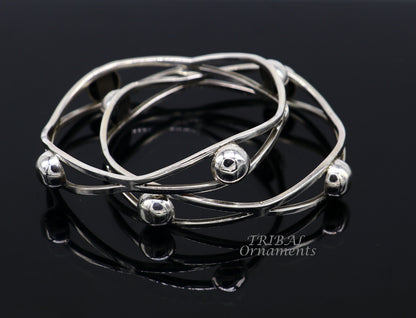 Sterling silver ball design bangle bracelet from TRIBAL ORNAMENTS, featuring floral details in a handmade wedding jewelry style.