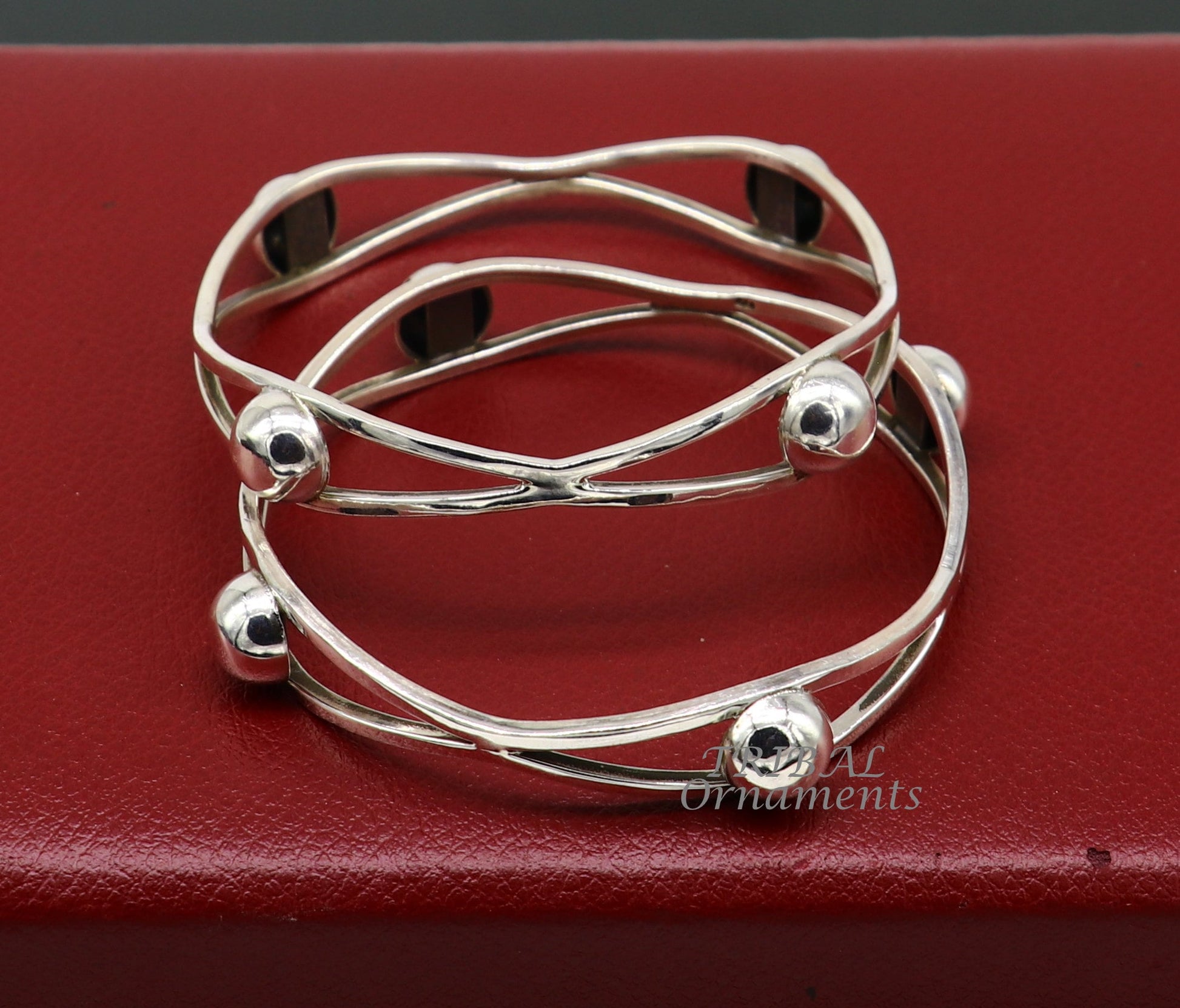 Sterling silver ball design bangle bracelet from TRIBAL ORNAMENTS, featuring floral details, perfect for wedding jewelry collection.