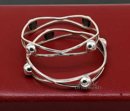 Sterling silver ball design bangle bracelet from TRIBAL ORNAMENTS, featuring floral details, perfect for wedding jewelry collection.