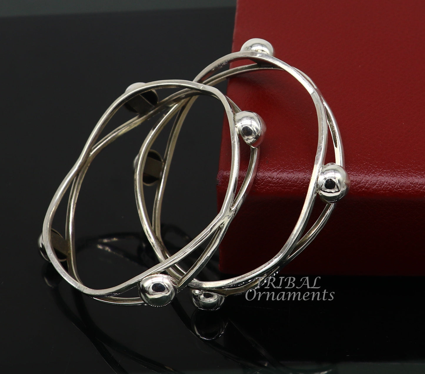 Sterling silver ball design bangle bracelet with floral details from Tribal Ornaments, ideal for wedding jewelry and bridal collection.