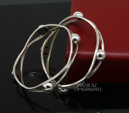 Sterling silver ball design bangle bracelet with floral details from Tribal Ornaments, ideal for wedding jewelry and bridal collection.