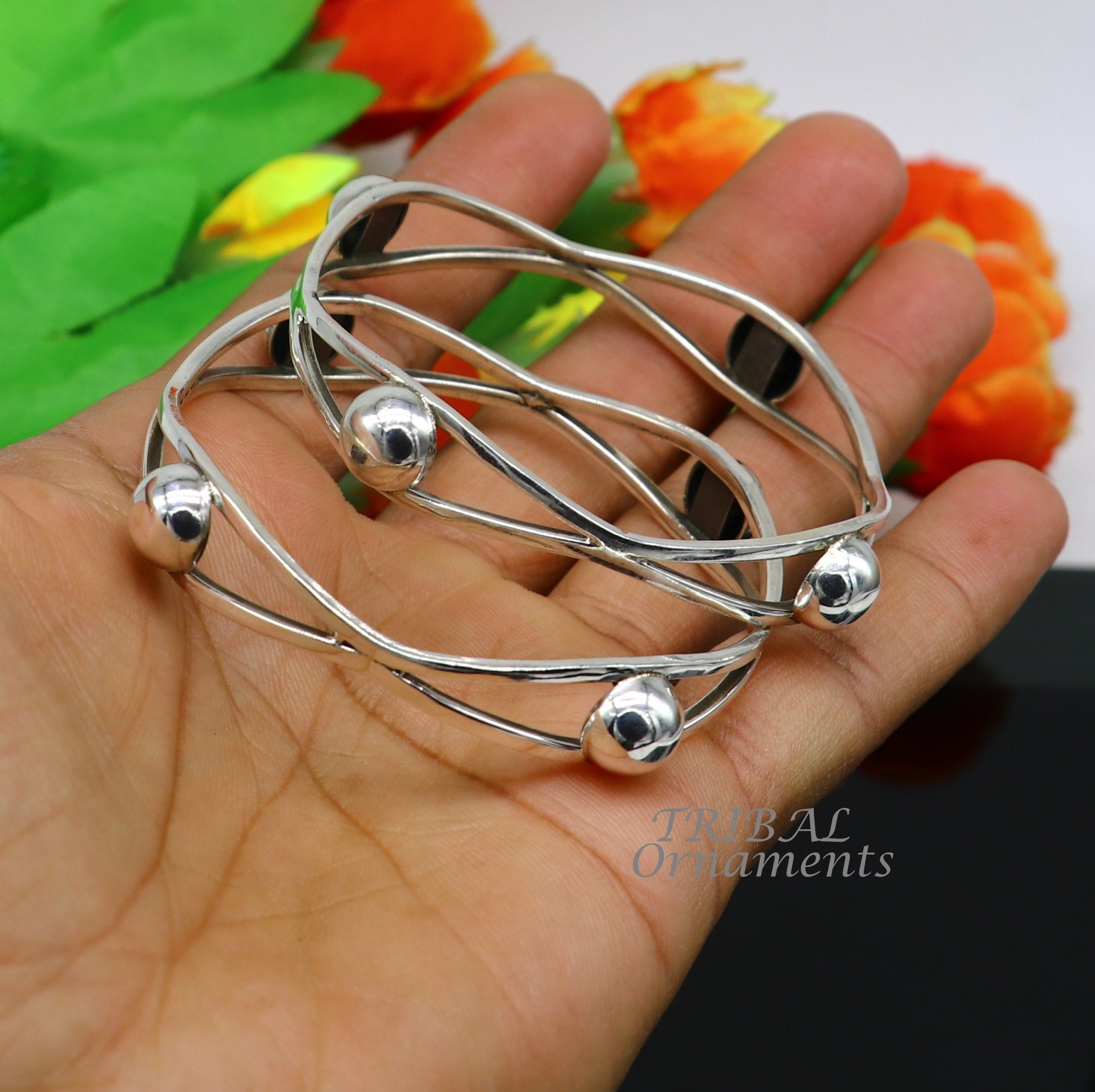 Sterling silver ball design bangle bracelet from TRIBAL ORNAMENTS, featuring a floral pattern, ideal for bridal wedding jewelry.