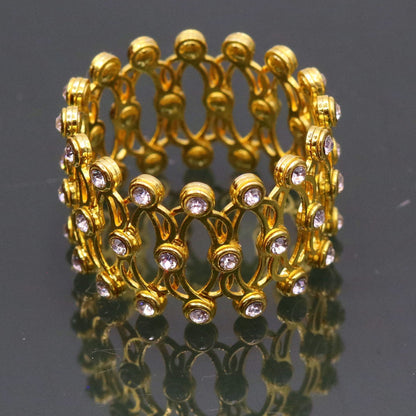Sterling silver gold-polished handmade adjustable bangle or ring band from TRIBAL ORNAMENTS, suitable for girls and women in India.