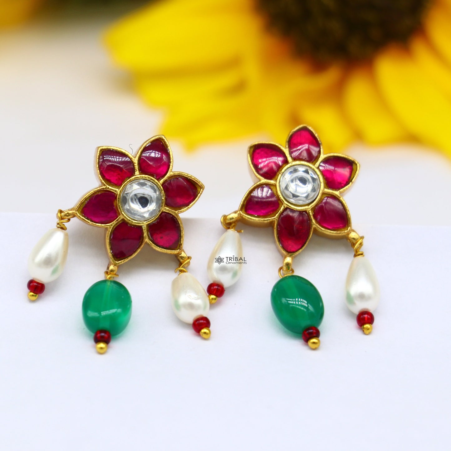 925 sterling silver gold polished kundan work stud earrings with green and red stones in a floral shape, modern trendy jewelry.