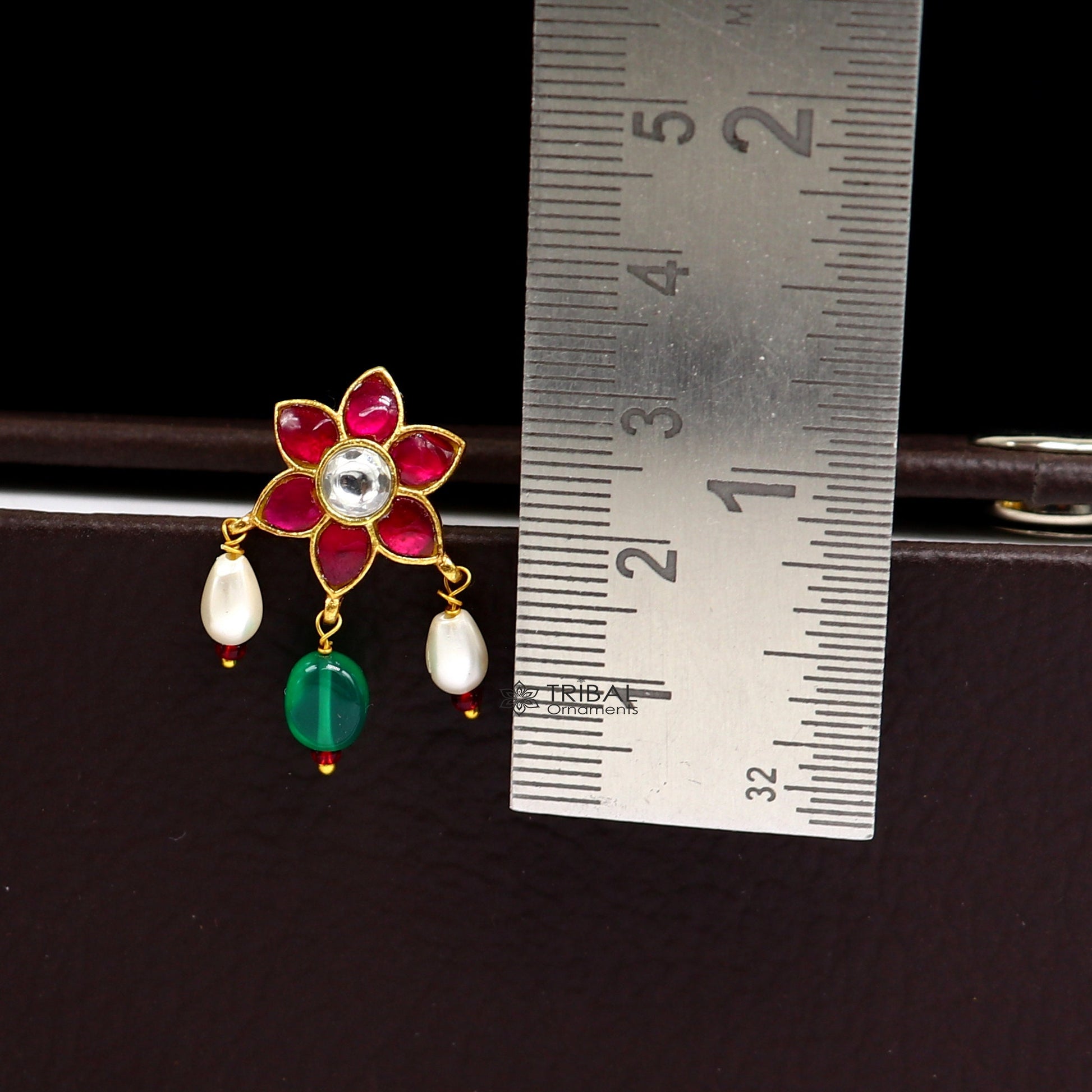 Sterling silver handmade Kundan stud earrings with green and red stones in floral design, modern trendy jewelry by TRIBAL ORNAMENTS.