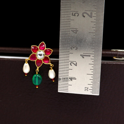 Sterling silver handmade Kundan stud earrings with green and red stones in floral design, modern trendy jewelry by TRIBAL ORNAMENTS.