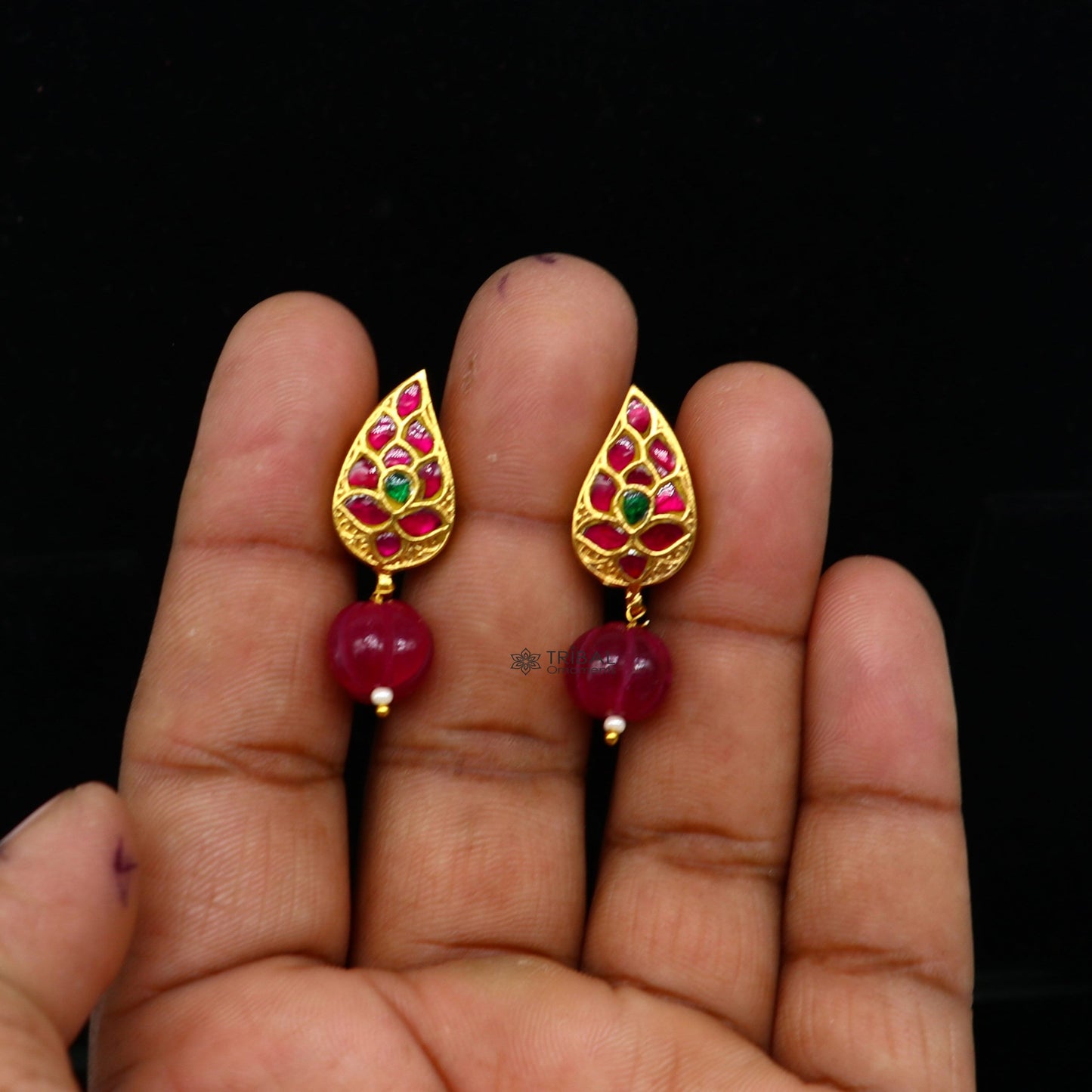 Sterling silver gold-polished Kundan flower-shaped stud earrings with green and red stones, handcrafted tribal jewelry by TRIBAL ORNAMENTS.