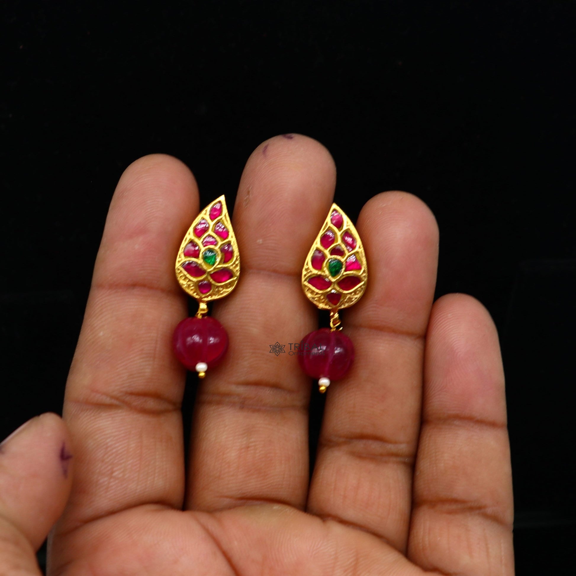 Sterling silver gold-polished Kundan flower-shaped stud earrings with green and red stones, handcrafted tribal jewelry by TRIBAL ORNAMENTS.