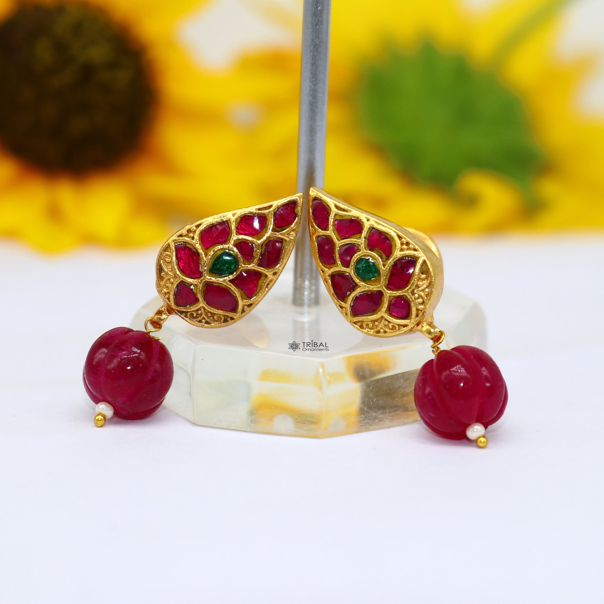 Sterling silver gold-polished Kundan work flower-shaped stud earrings with green and red stones, trendy handmade jewelry by Tribal Ornaments.