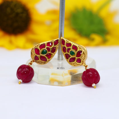 Sterling silver gold-polished Kundan work flower-shaped stud earrings with green and red stones, trendy handmade jewelry by Tribal Ornaments.