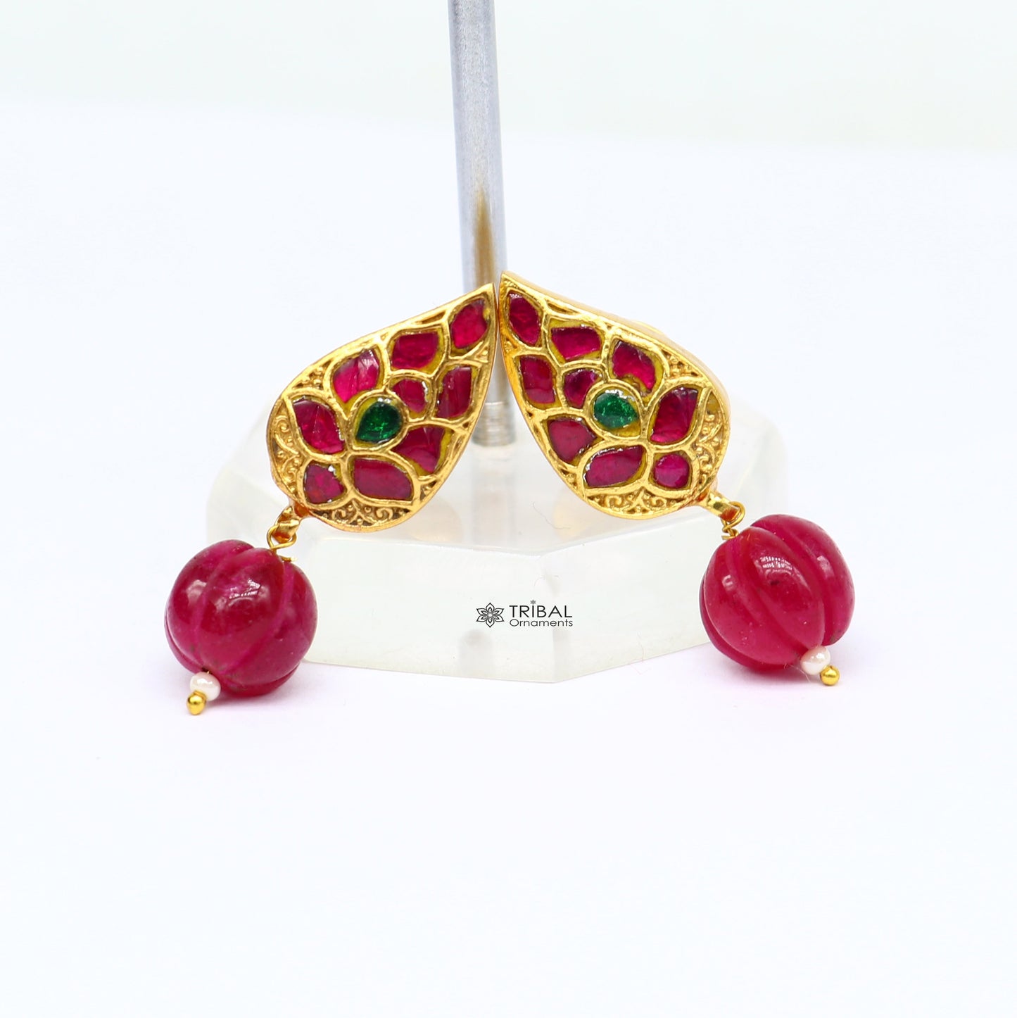 Sterling silver gold-polished handmade kundan flower-shaped stud earrings with green and red stones, modern tribal jewelry.