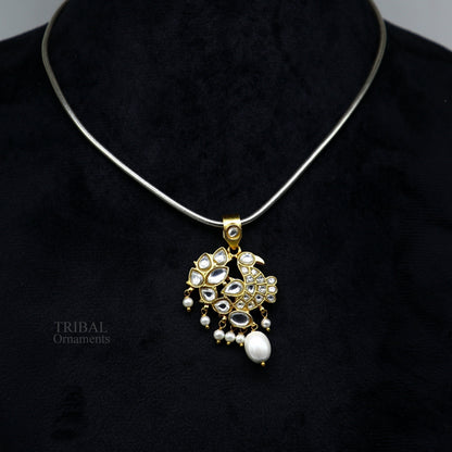 Sterling silver and gold-plated peacock pendant with red and green stone drops, stylish tribal jewelry by TRIBAL ORNAMENTS.