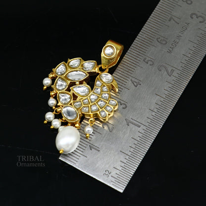 Sterling silver gold-plated peacock pendant with red and green stone drops, stylish dangle jewelry by Tribal Ornaments.