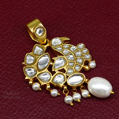Sterling silver gold-plated peacock pendant with red and green stone drops, stylish dangle jewelry by Tribal Ornaments.