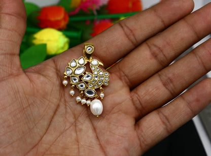 Sterling silver and gold-plated peacock pendant with red and green stone drops, stylish dangling jewelry by TRIBAL ORNAMENTS.