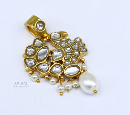 Sterling silver and gold-plated peacock pendant with red and green stone drops, stylish dangle jewelry by TRIBAL ORNAMENTS.