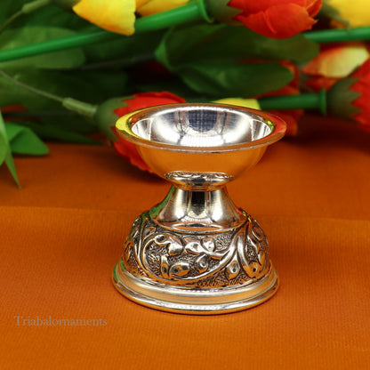 Sterling silver oil lamp with intricate chitai and kandrai work, traditional silver Deepak for Diwali puja and temple rituals.