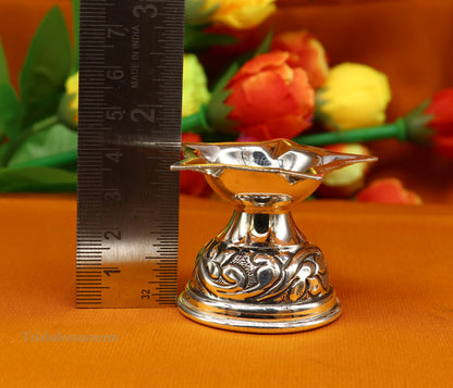 Sterling silver oil lamp with intricate Chitai and Kandrai work, traditional Deepak for Diwali puja, crafted by TRIBAL ORNAMENTS.