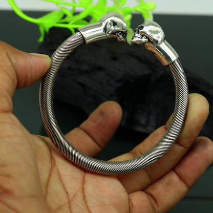 Sterling silver hip-hop skull design bangle bracelet by Tribal Ornaments, unisex cuff jewelry with personalized engraving.