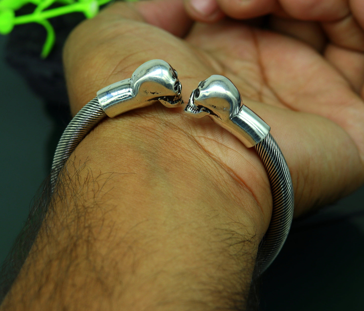Sterling silver hip-hop skull design bangle bracelet by TRIBAL ORNAMENTS, unisex jewelry with personalized style.