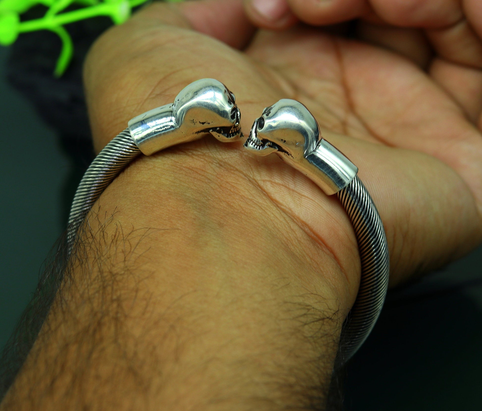 Sterling silver hip-hop skull design bangle bracelet by TRIBAL ORNAMENTS, unisex jewelry with personalized style.