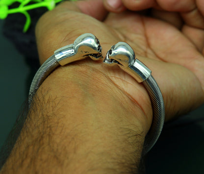 Sterling silver hip-hop skull design bangle bracelet by TRIBAL ORNAMENTS, unisex jewelry with personalized style.