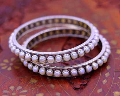 Sterling silver pearl bangle bracelet with oxidized finish, Indian bridal jewelry by TRIBAL ORNAMENTS, single bangle design.