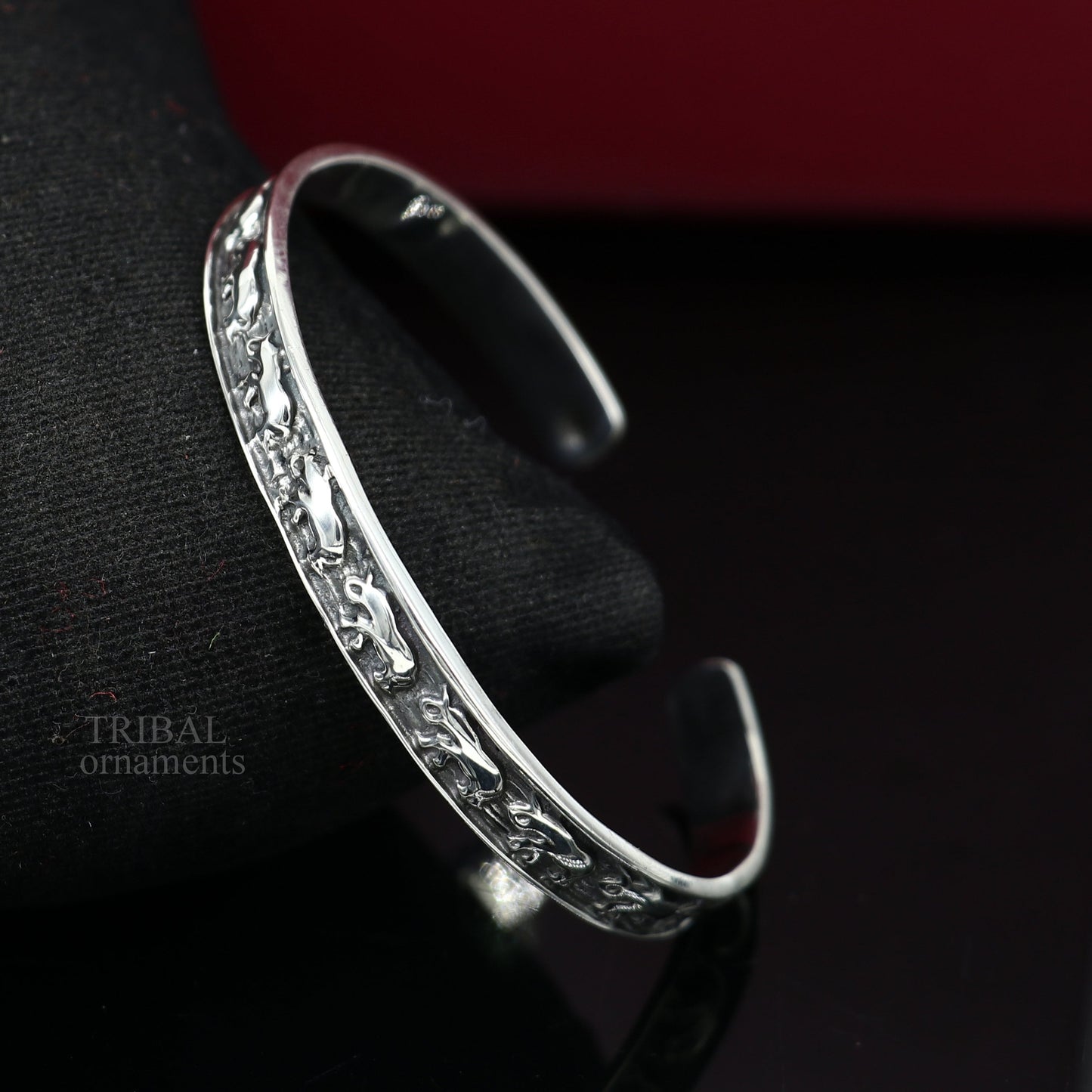 Sterling silver elephant design cuff bracelet by TRIBAL ORNAMENTS, featuring a waved open-face bangle for unisex gifting jewelry.