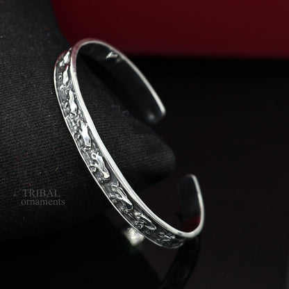 Sterling silver elephant design cuff bracelet by TRIBAL ORNAMENTS, featuring a waved open-face bangle for unisex gifting jewelry.