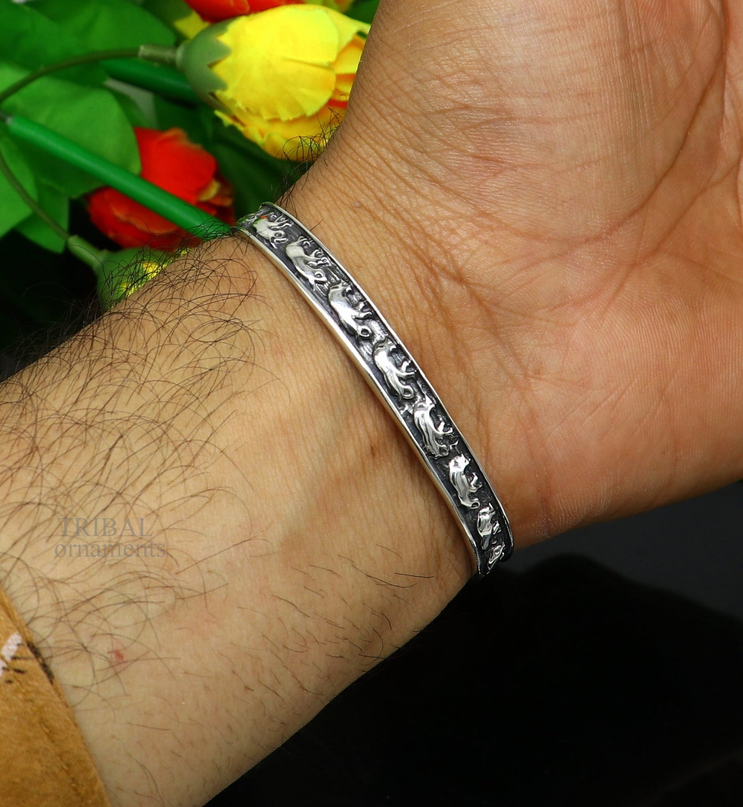 Sterling silver elephant design cuff bracelet by TRIBAL ORNAMENTS, featuring a wavy open face style, perfect for gifting or everyday wear.