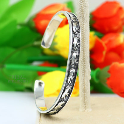 Sterling silver elephant design cuff bracelet by TRIBAL ORNAMENTS, featuring a waved open-face bangle for unisex jewelry gifting.