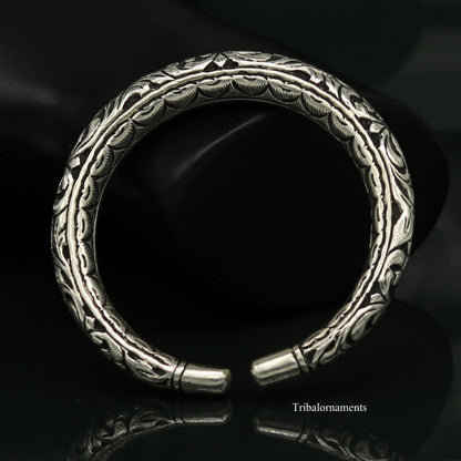 Sterling silver tribal bangle bracelet with handcrafted chitai work, oxidized vintage design, and tribal jewelry style.