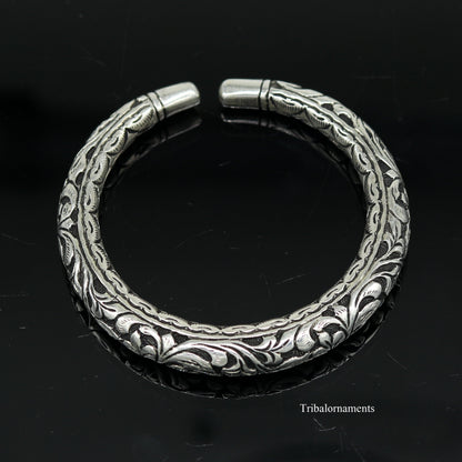 Sterling silver tribal bangle bracelet with handcrafted chitai work, oxidized vintage design, stylish and customized tribal jewelry.