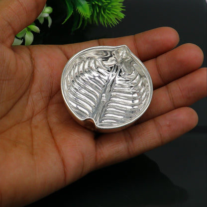 Sterling silver handcrafted tilak and sindur bowl with intricate design, used for puja rituals and baby feeding.