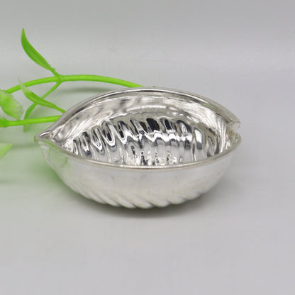 Handcrafted 925 sterling silver tilak and sindur bowls with intricate tribal design, suitable for puja and home temple use.