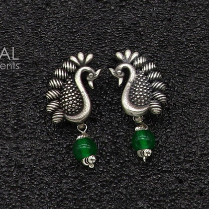 Sterling silver handcrafted peacock design stud earring with drop dangle style, modern and stylish for party wear or gifting.
