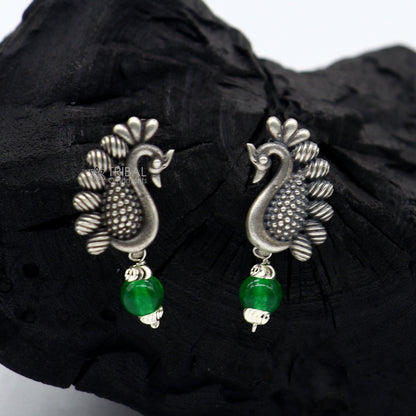 Sterling silver handcrafted peacock design stud earring with drop dangle style, stylish party wear jewelry by Tribal Ornaments.