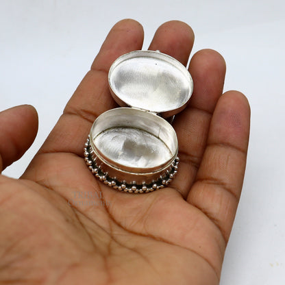Handcrafted 925 sterling silver oval-shaped trinket box with red stone accents, ideal for jewelry, kajal, or sindur storage.